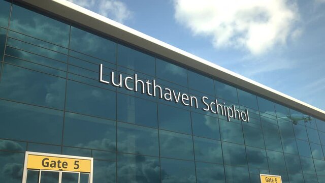 Taking off airplane reflecting in the modern windows with Luchthaven Schiphol or Airport Schiphol text