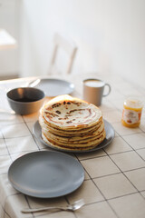  Stack of delicious homemade pancakes on a plate with coffee. Good morning, breakfast concept. Food photography. Copy space, flat lay