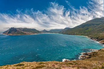 Fototapeten panaramic view on Hout Bay, the southern Harbor of Cape Town, with characteristic table cloth clouds rolling over the mountains,South Africa, landscape  © Uwe