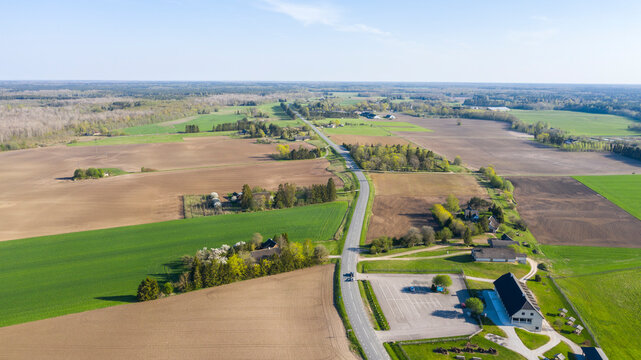 Aerial scenic view to the spring green rural farmland in Saaremaa isl, Estonia