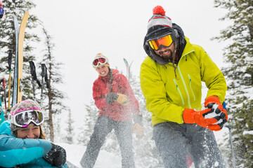 Group of backcountry skiers having a snowball fight