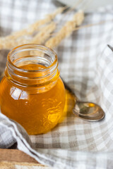 Honey jar with spoon. Autumn harvest.