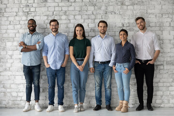 Group portrait of diverse millennial team of employees, company workforce, department staff. Happy...