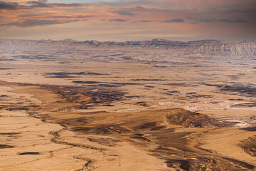 Ramon Crater Makhtesh Ramon, the largest in the world, as seen from the high rocky cliff edge surrounding it from the north, Ramon Nature reserve, Mitzpe Ramon, Negev desert, Israel. High quality