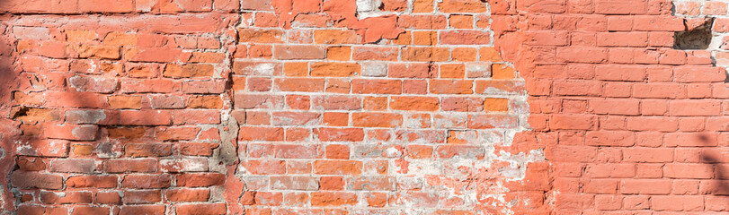 Panoramic scenery with old red brick wall and the shadows of the leaves