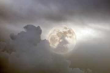 Full moon in a cloudy night