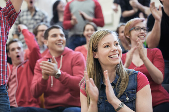 Female Student Clapping At College Sporting Event