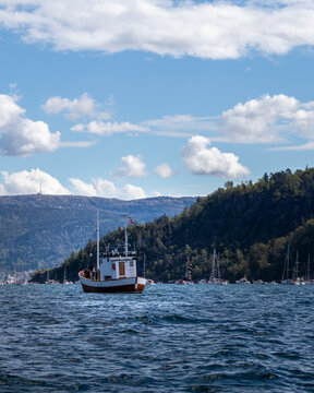 Old Fishing Boat On The Sea Near Mountains, Bergen Norway 17th Of May, A Lot Of Boats.