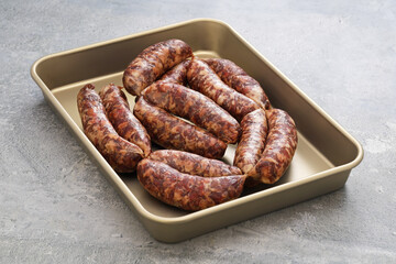 homemade salami sausage in tray