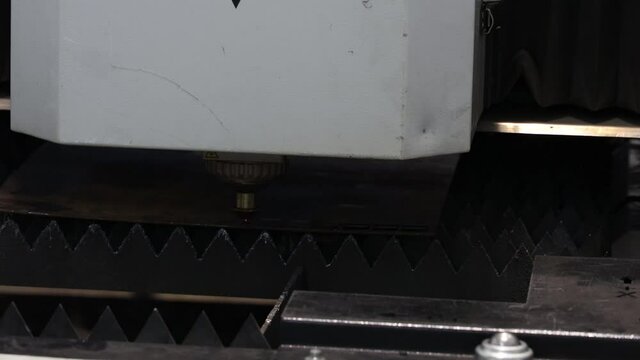 the plasma cutter at the machine-building enterprise cuts the metal billet of the billet