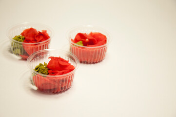 delivery of Asian food vassabi and ginger in disposable utensils. High quality photo