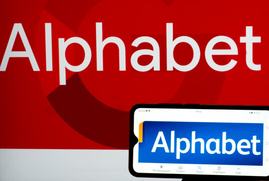 In this photo illustration Alphabet logo seen displayed on a smartphone