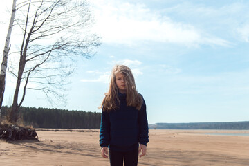 girl standing on river shore
