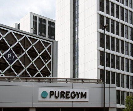 leeds, west yorkshire, united kingdom - 11 may 2021: sign above the entrance to puregym and at the merrion centre in leeds surrounded by modern apartments