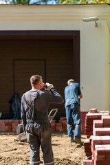 couple in front of house