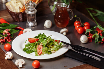 Caesar salad with chicken, cherry tomatoes, lettuce