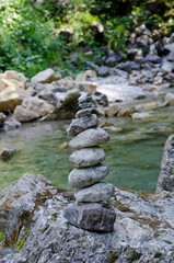 Closeup of stone balance on rock in the river