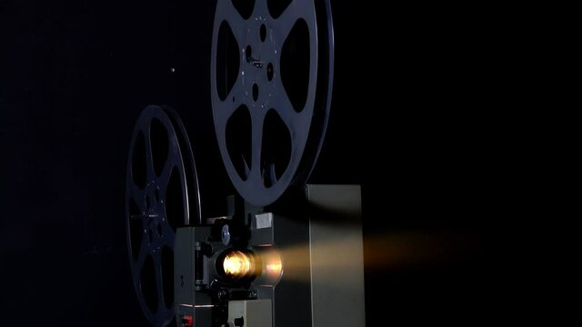 Front view of an old-fashioned antique film projector.