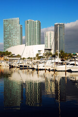 Sailboats and yachts are docked at Miami’s Bayside Marina