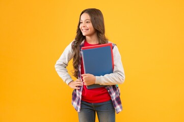 Education comes first. Happy child hold study books. Basic education. Back to school.