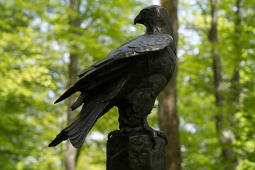 Iron eagle sculpture in the woods at City of Zurich. Photo taken May 18th, 2021, Zurich, Switzerland.