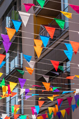 Spanish Catholic Holiday Party Decorations With Colored Flags In Barcelona, Spain