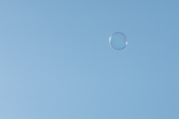 Soap Bubbles Floating On Blue Sky
