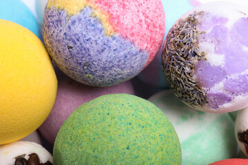 Colorful bath bombs as background, above view