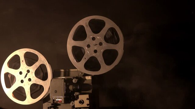 Front view of an old-fashioned antique film projector.