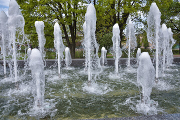 In the summer, fountains are turned on in the city.