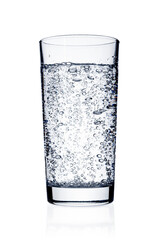 Glass with sparkling water close up isolated on white background