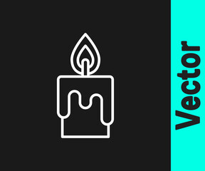 White line Burning candle icon isolated on black background. Cylindrical candle stick with burning flame. Vector