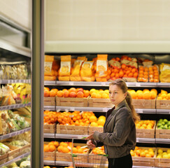 Woman buying fruits and vegetables at the market