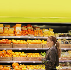 Woman buying fruits and vegetables at the market