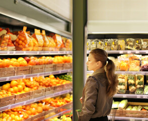 Woman buying fruits and vegetables at the market