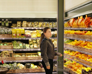 Woman buying fruits and vegetables at the market