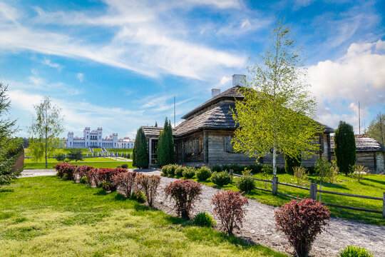 Houses on beautiful landscape - village of birthplace of Tadeusz Kosciuszko - Kossovo, Brest region, Belarus. And Kosava palace on the background