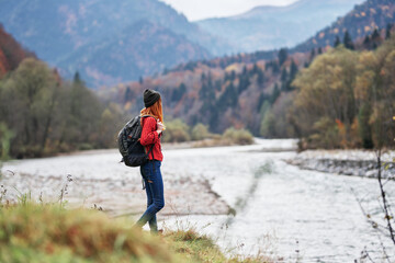 Obraz premium woman travel tourism mountains landscape lake river autumn