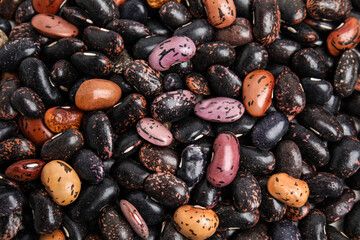 Heap of raw beans as background, top view. Veggie seeds