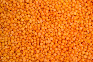 Heap of red lentils as background, top view. Veggie seeds