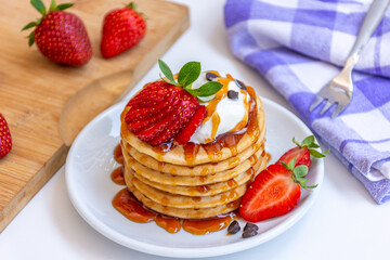 Home made Fresh Pancake with Honey and Strawberry Syrup and Strawberry topping 