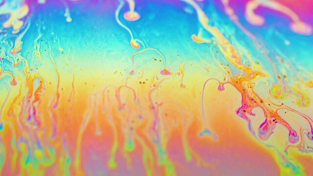 abstract colorful background.  iris texture of a soap bubble in motion