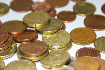 different euro coins on white ground 