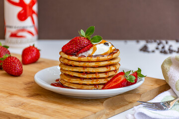 Home made Fresh Pancake with Honey and Strawberry Syrup and Strawberry topping 