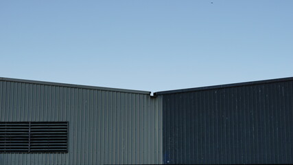 Fototapeta na wymiar roof of industrial buildings facades