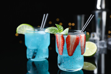 Cool light blue drinks on black table