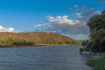 Fototapeta na wymiar Sunset and evening mood on the Kunene River, Namibia