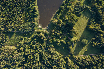 Aerial view of pond with island in Rudbarzi, Latvia.