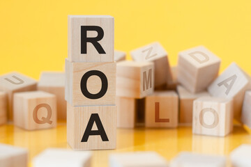 acronym ROA from wooden blocks with letters, concept