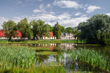 Fototapeta na wymiar View of Kabile village and pond, Latvia.